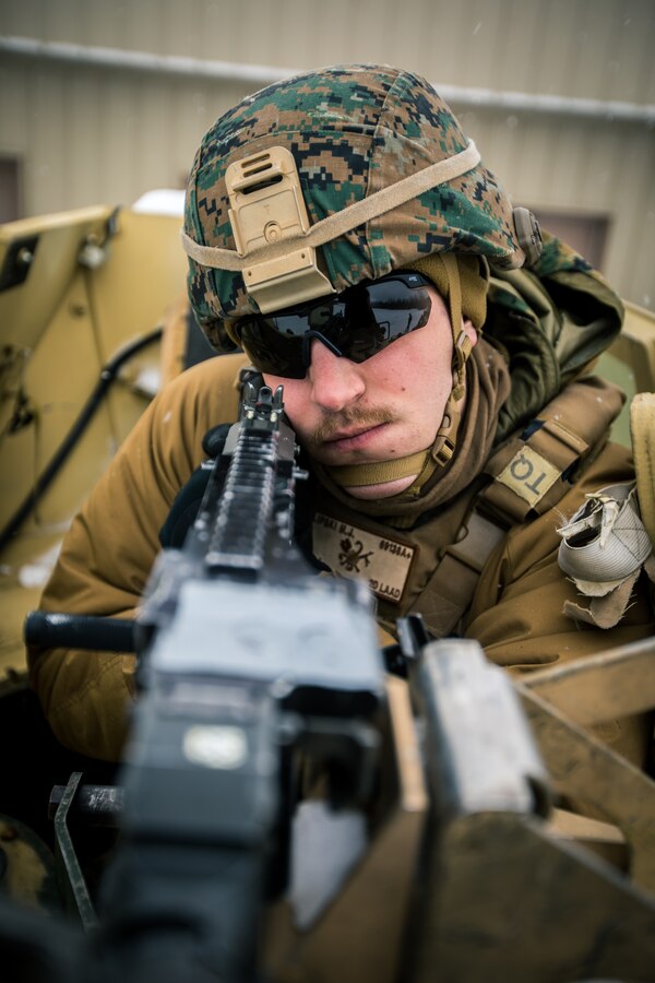 Cpl. Matthew J. Lipski, a low altitude air defense gunner with 2nd LAAD, Marine Air Control Group 28, 2nd Marine Aircraft Wing, prepares to engage a target with a M240-B machine gun during a machine gun range at Fort Greely, Alaska, Feb. 22, 2020, in preparation for exercise Arctic Edge 2020. Arctic Edge enables Marines to quickly identify threats in the arctic, respond promptly and effectively, and shape security to mitigate future threats. (U.S. Marine Corps photo by Lance Cpl. Jose Gonzalez)