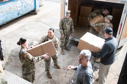 Members of the West Virginia National Guard help state agencies transport and deliver critical medical supplies to hospitals, clinics and local health departments to help fight the COVID-19 pandemic March 24, 2020, in Poca, West Virginia. Workers packaged surgical masks, respirators, sterile gowns, and examination gloves for rapid dispatch and delivery around the state.