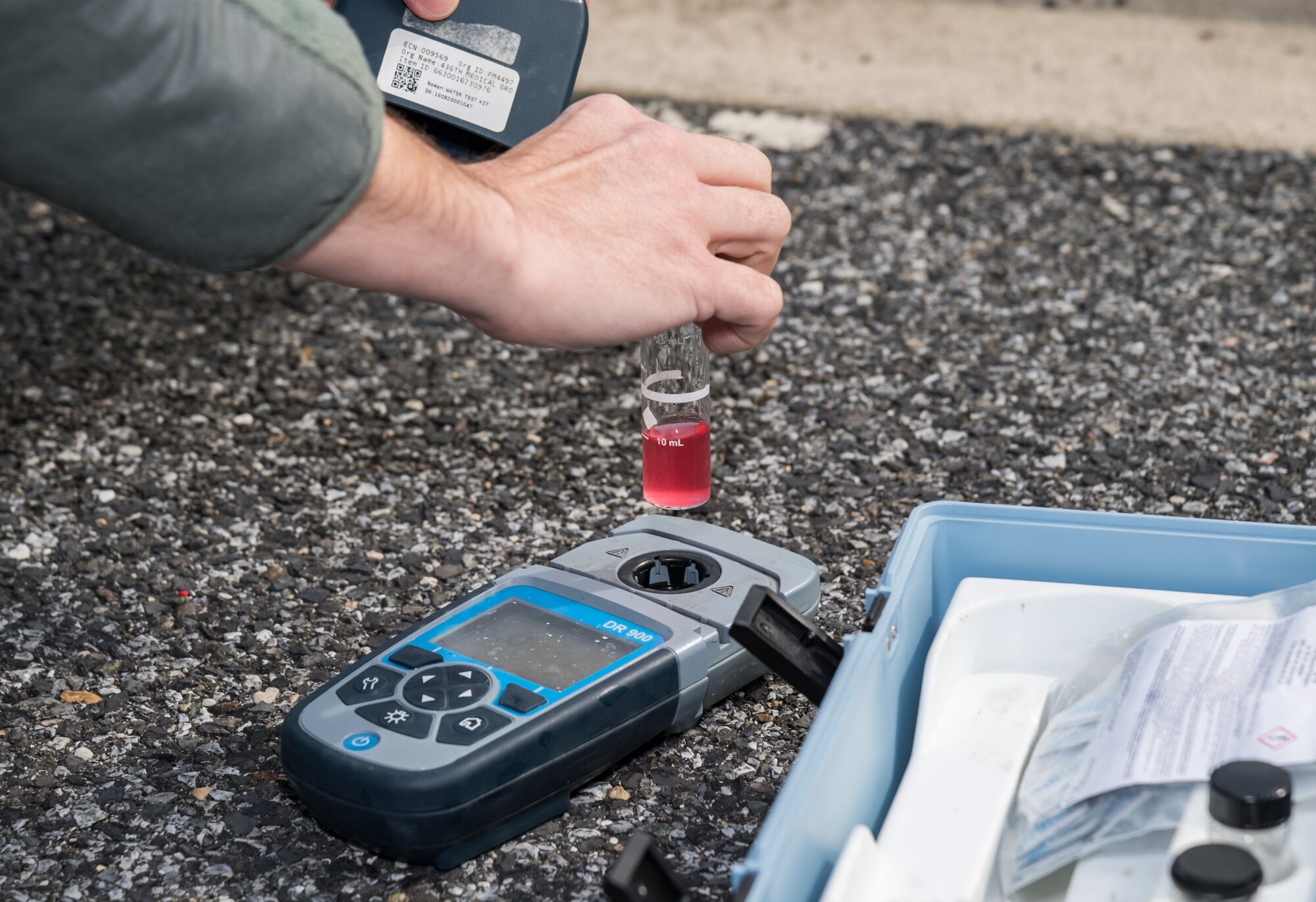 Tech. Sgt. James Warren, 436th Operational Medical Readiness Squadron bioenvironmental engineering flight noncommissioned officer in charge, tests non-potable water for pH and chlorine levels March 18, 2020, at the main gate on Dover Air Force Base, Delaware. Warren used a Hach DR900 Colorimeter to perform the two tests on the water used by 436th Operational Medical Readiness Squadron personnel to wash their hands. (U.S. Air Force photo by Roland Balik)
