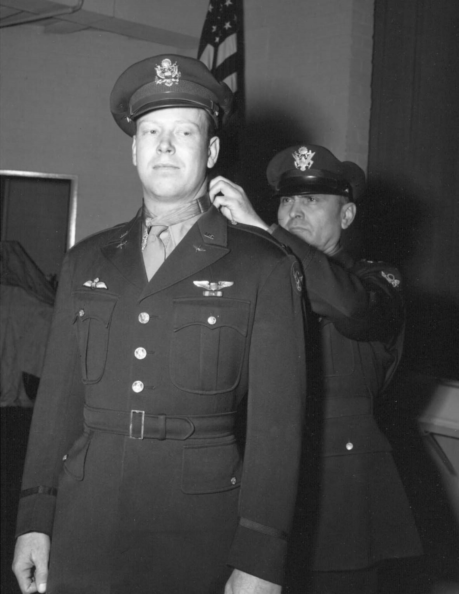 U.S. Air Force Lt. Gen. Ira Eaker, Eighth Air Force commander, presents the Medal of Honor to 1st Lt. John C. Morgan Dec. 17, 1943. (Courtesy photo)