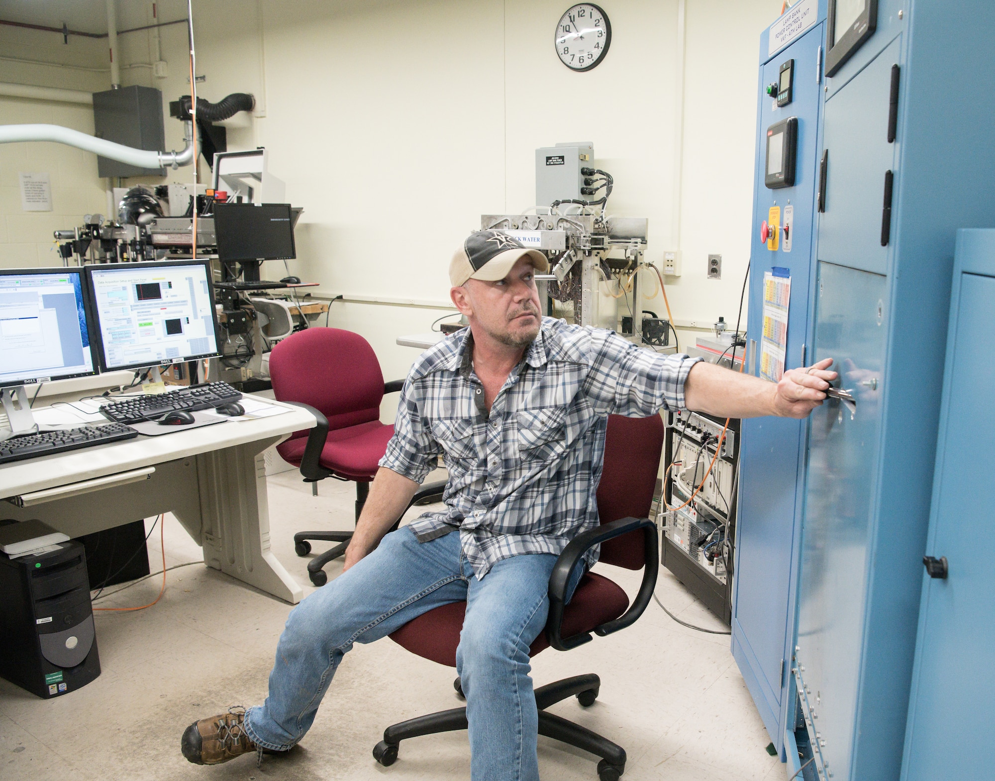 Brian Anderson, an instrumentation specialist, operates the Arc Lamp System in the Aerothermal Calibration Laboratory Jan. 15, 2020, while demonstrating the use of the machine to provide heat to a test cone for use at Arnold Air Force Base, Tenn. (U.S. Air Force photo by Jill Pickett)