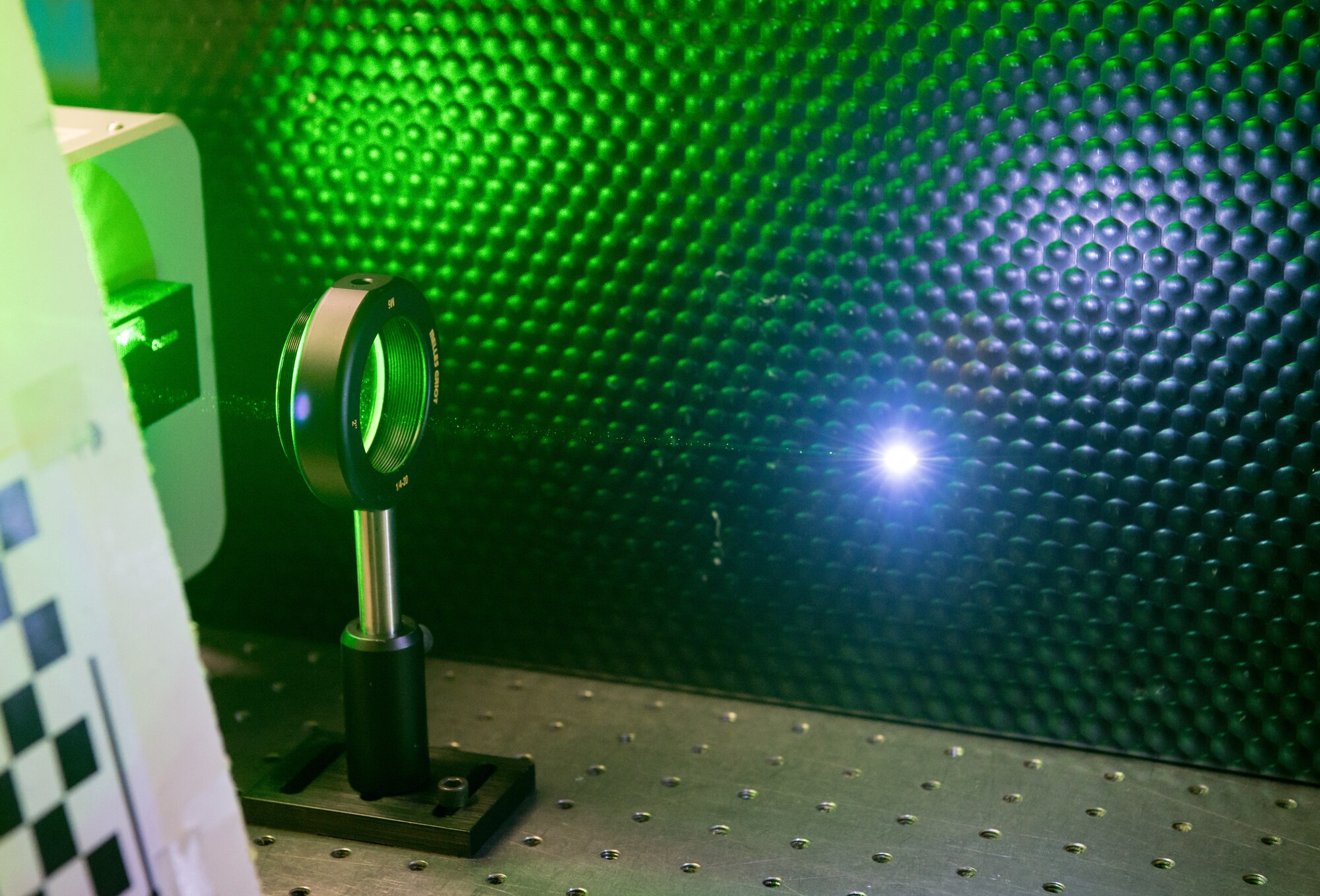 A pulse laser ionizes air Jan. 13, 2020, in the Laser Laboratory at Arnold Air Force Base, Tenn. The Arnold Engineering Development Complex (AEDC) Test Technology, Analysis and Evaluation Branch develops measurement and diagnostic techniques utilizing the lasers in the lab that can then be fielded in AEDC test cells.  (U.S. Air Force photo by Jill Pickett)