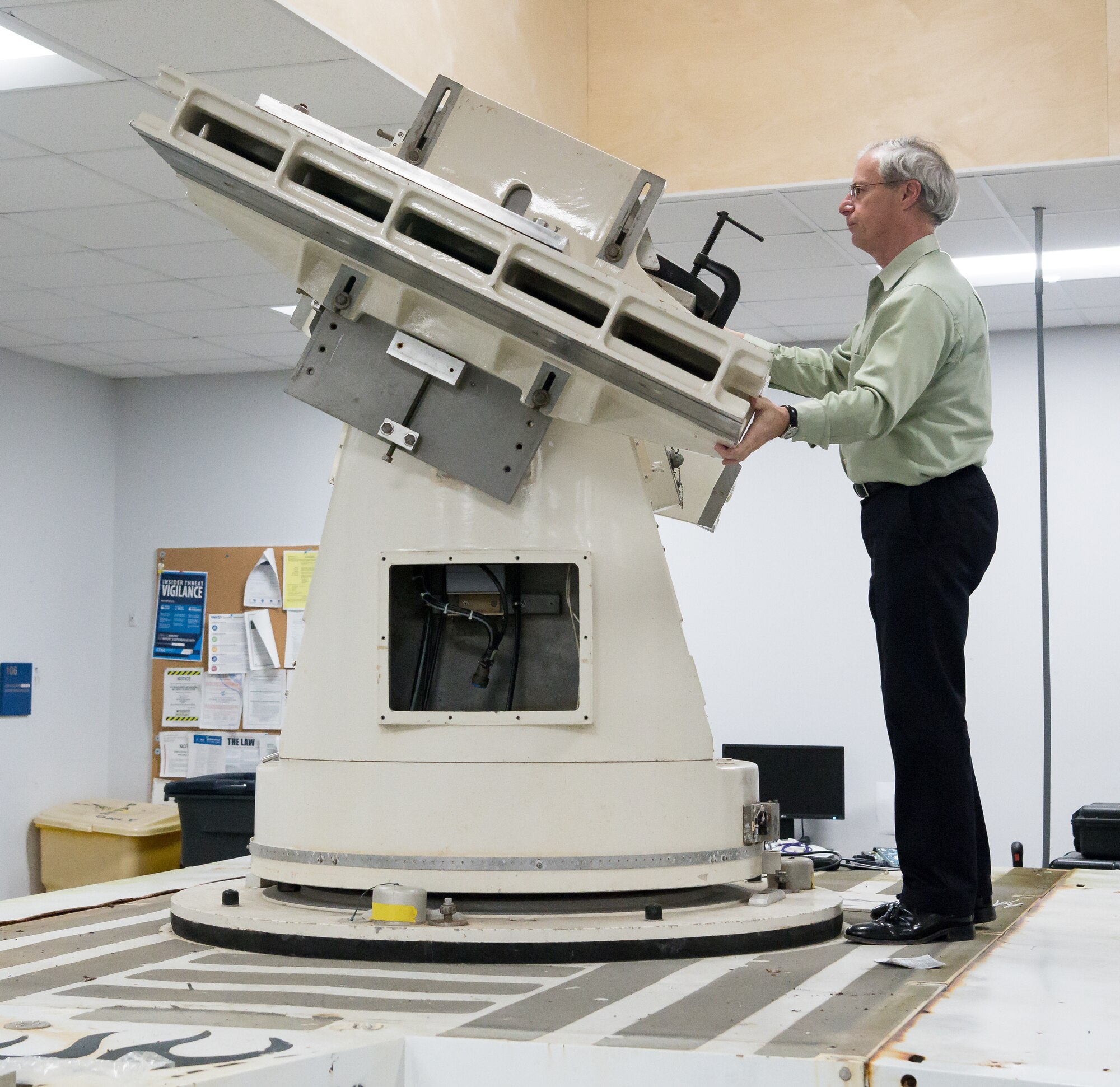 Dr. Joe Wehrmeyer, technical advisor for the Technology Section of Arnold Engineering Development Complex Test Technology, Analysis and Evaluation Branch, shows how a Joint Standard Instrumentation Suite platform can make complex movements to track a missile in flight Jan. 13, 2020, in the Optics Laboratory at Arnold Air Force Base, Tenn. Equipment mounted to the platform captures data during missile testing. (U.S. Air Force photo by Jill Pickett)