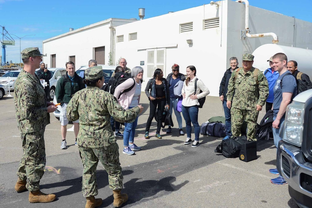 Navy reservists receive instructions as they prepare to board a hospital ship.