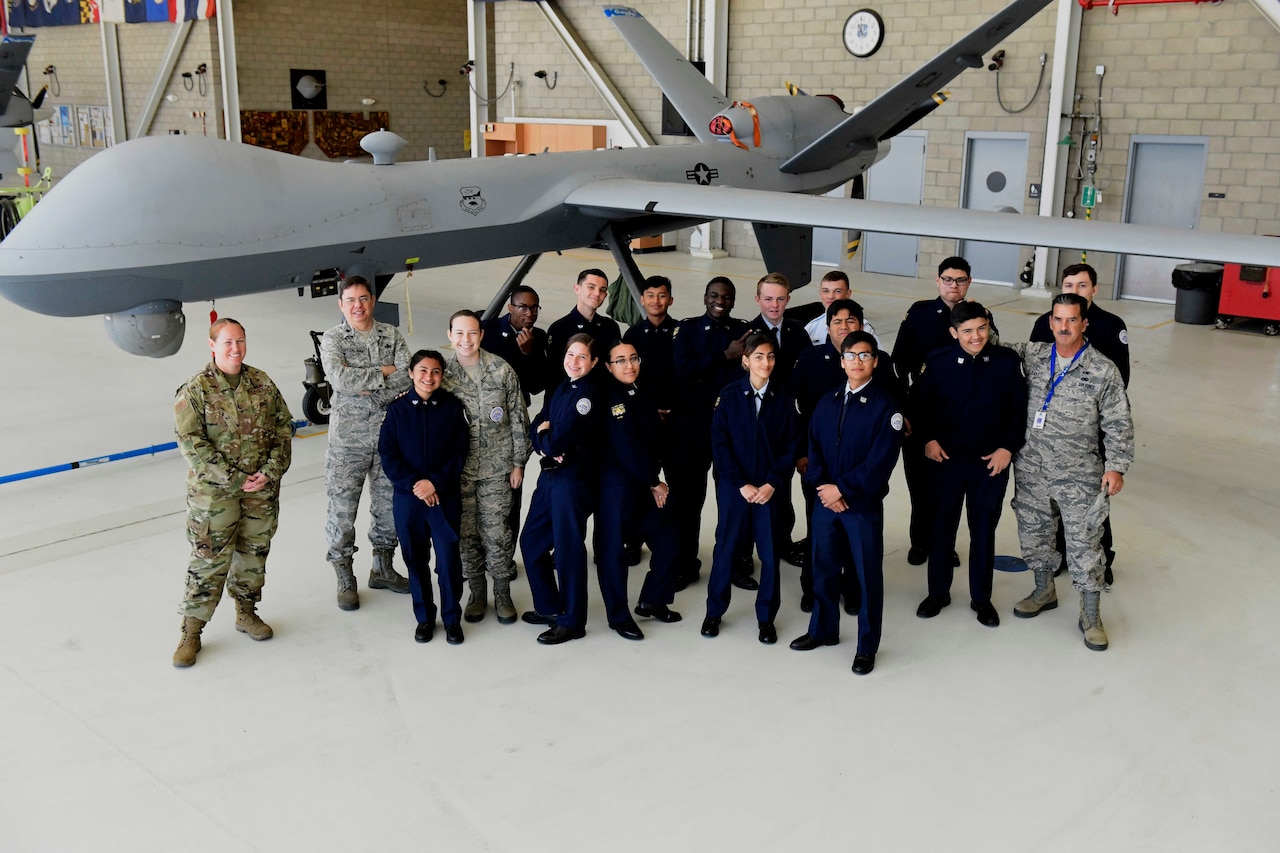 Cadets stand in front of a remotely piloted vehicle.