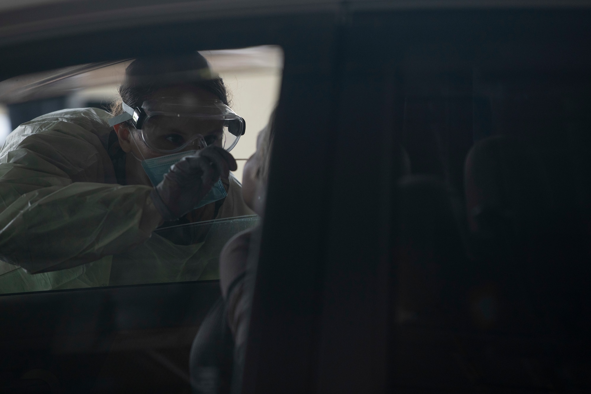 Airmen from the 18th Medical Group conduct COVID-19 testing at Kadena Air Base, Japan, March 20. Under the most current guidance from the Centers for Disease Control, the 18 MDG has increased its testing for the disease.