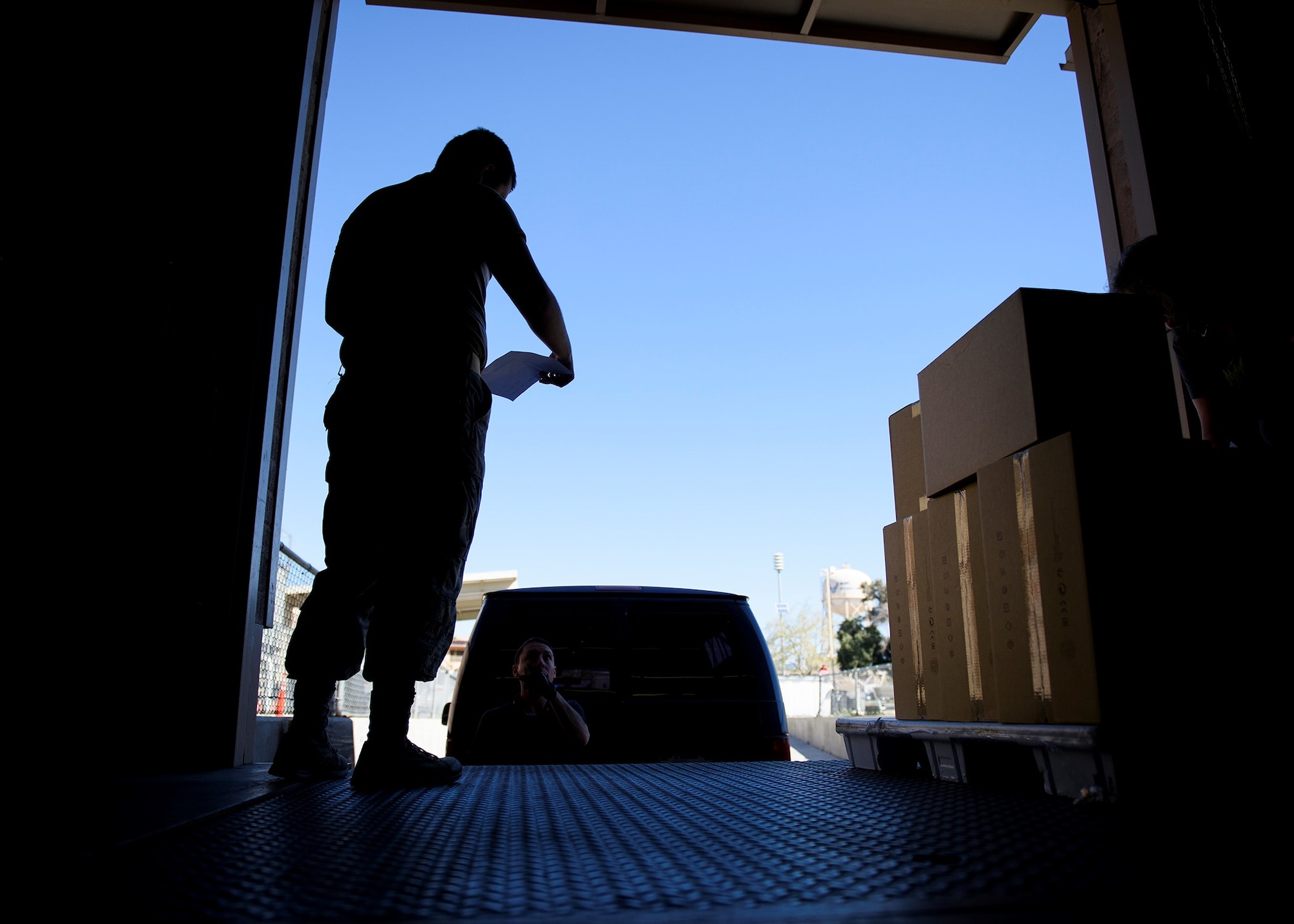 An Airmen prepares to unload boxes.