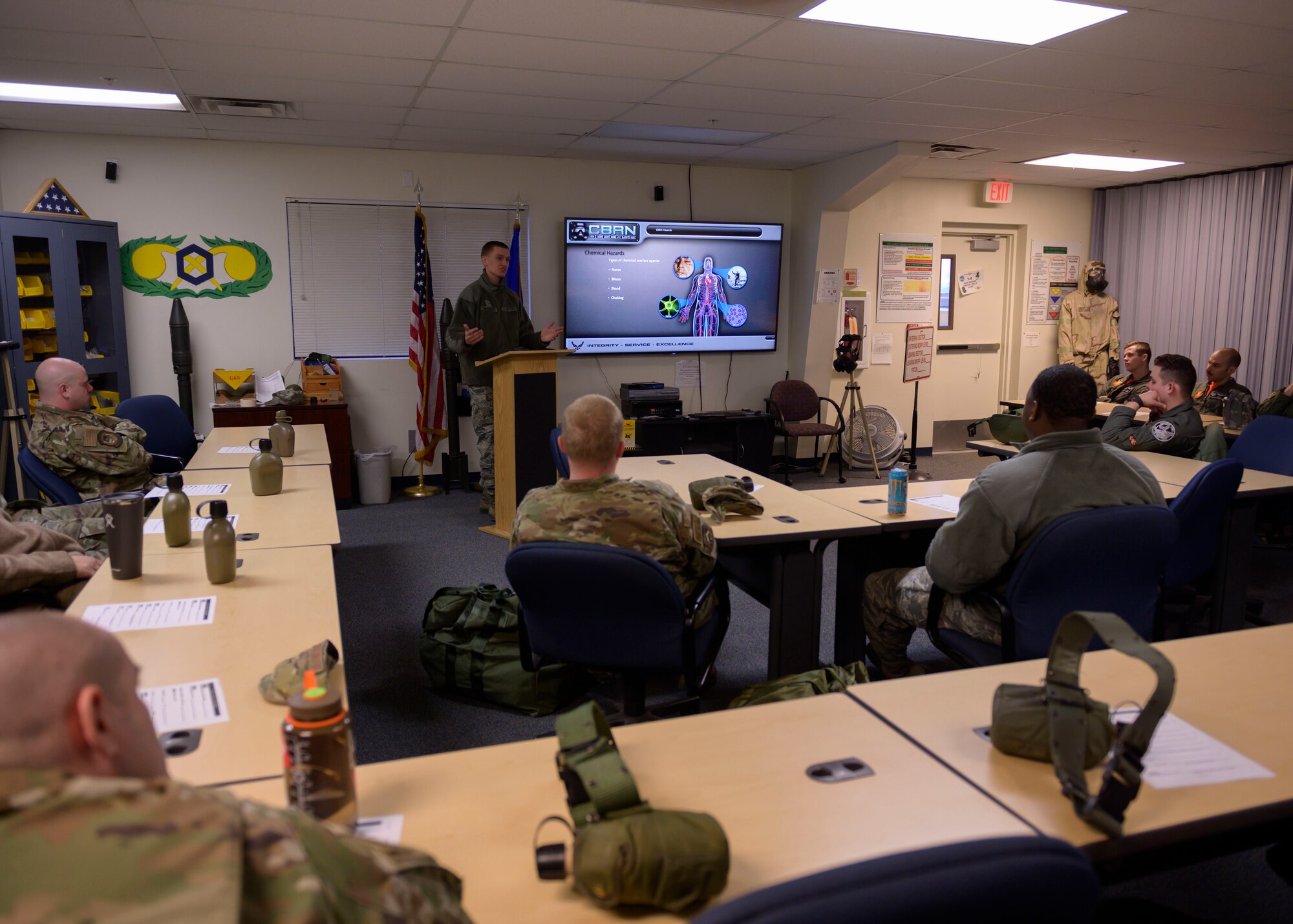 Airman 1st Class Nathan McMaster, 366th Civil Enginer Squadron emergency management technician, teaches a class on chemical, biological, radiological and nuclear defense (CBRN), March 20, 2020, at Mountain Home Air Force Base, Idhao. Airmen learn about CBRN as a part of required combat skills training, increasing their readiness. (U.S. Air Force photo by Senior Airman Tyrell Hall)