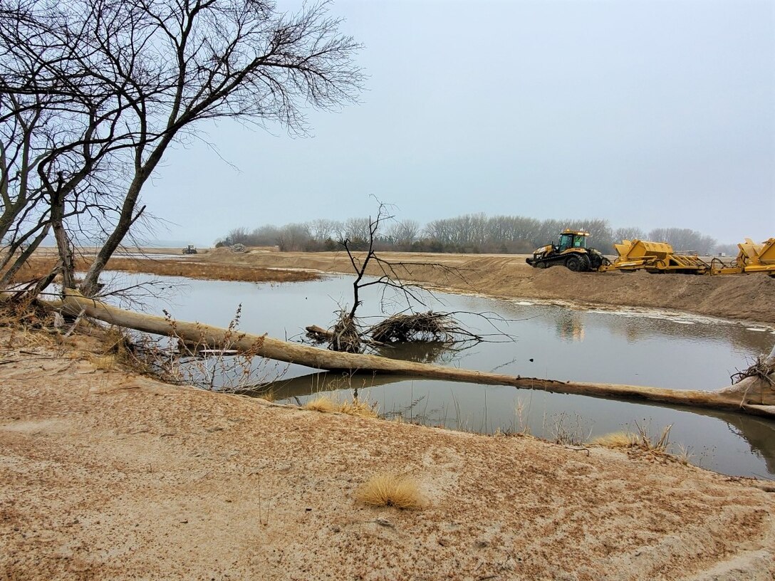 U.S. Army Corps of Engineers removes temporary dike as part of full levee restoration effort near Ames, Neb., Mar. 25, 2020.