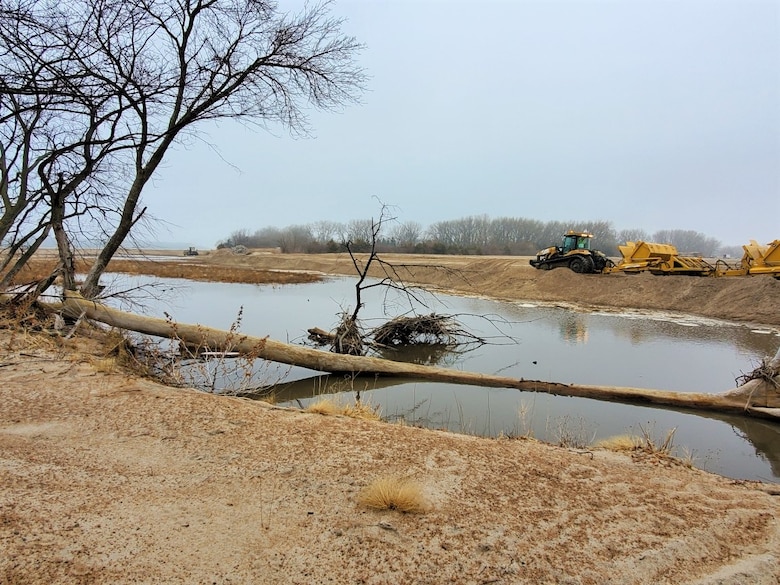 U.S. Army Corps of Engineers removes temporary dike as part of full levee restoration effort near Ames, Neb., Mar. 25, 2020.