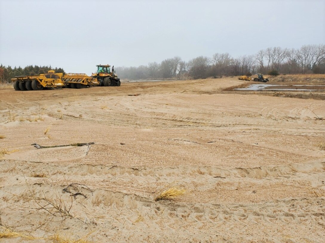 U.S. Army Corps of Engineers, Omaha District places sand to design elevation on Ames Diking in Ames, Neb., Mar. 25, 2020.