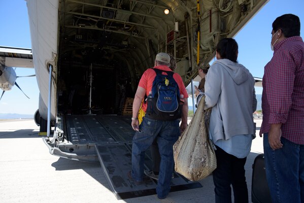 U.S. citizens board a U.S. Air Force C-130J Super Hercules at Soto Cano Air Base, Honduras, March 25, 2020.