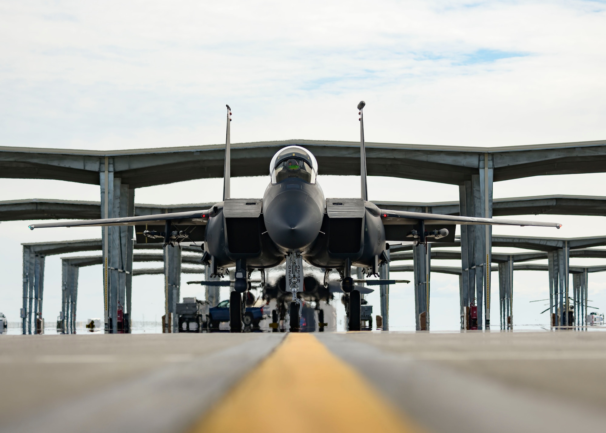 An F-15E Strike Eagle from the 391st Fighter Squadron, taxies from an overhang before flight, March 20, 2020, at Mountain Home Air Force Base, Idaho. The 391st FS is designated as an expeditionary squadron, deploying to support  the Air Force's air superiority. (U.S. Air Force photo by Senior Airman Tyrell Hall)