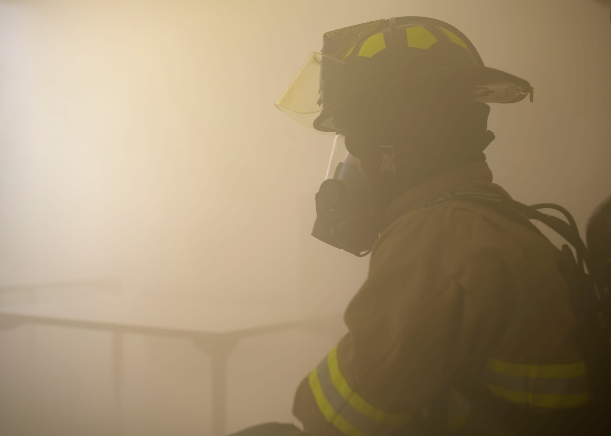 A fireman from the 366th Civil Engineer Squadron, participates in a training exercise, march 20, 2020, at Mountain Home Air Force Base. This training was conucted and designed to enhance readiness in response to emergency. (U.S. Air Force photo by Senior Airman Tyrell Hall)