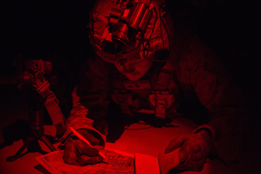 A U.S. Marine plots points on a map during exercise Native Fury 20 in the United Arab Emirates, March 22.