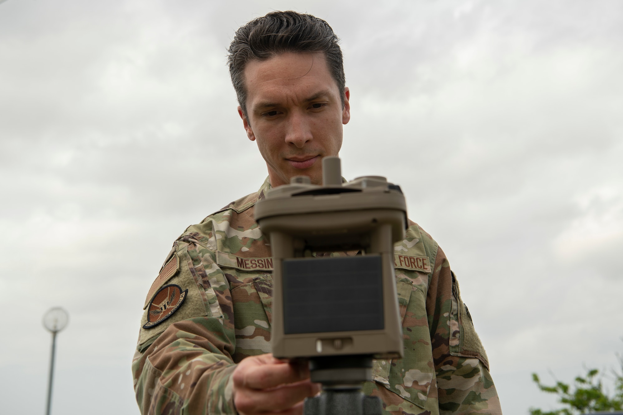 Senior Airman Thomas Messina, 18th Operations Support Squadron weather journeyman, inspects a micro weather sensor Mar. 26, 2020, at Kadena Air Base, Japan. Messina took measurements after a shift change ensuring his information was up-to-date for continued flight operations at Kadena AB. (U.S. Air Force photo by Senior Airman Rhett Isbell)