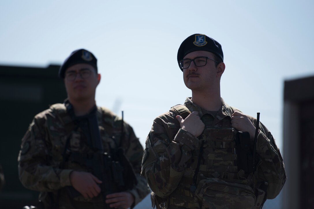 Two 86th Security Forces members participate in guard mount.