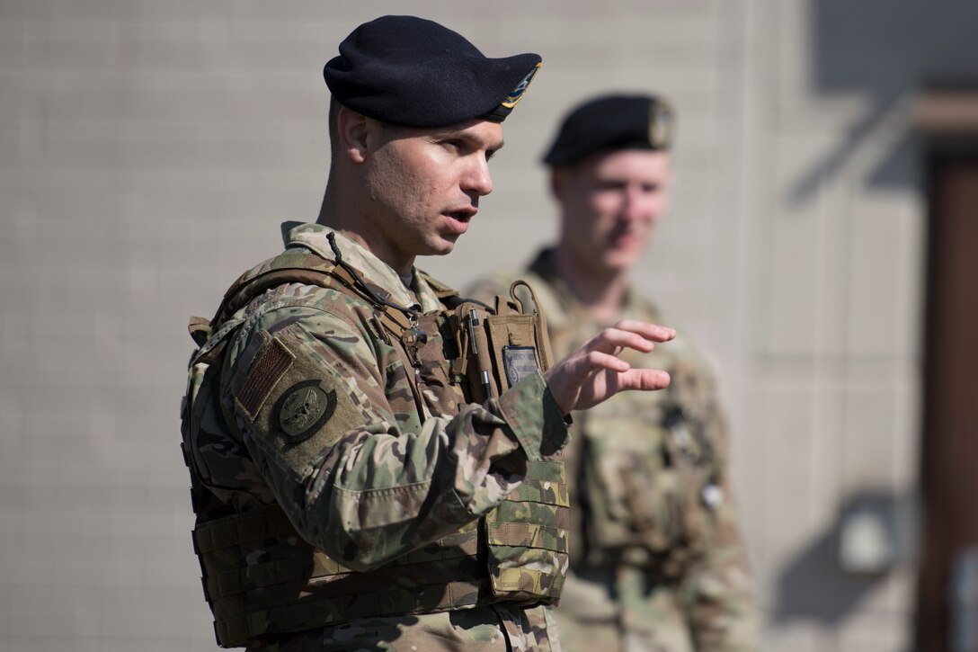 U.S. Air Force Master Sgt. Mike Alberty, 86th Security Forces Squadron flight chief, briefs Airmen during a guard mount on Ramstein Air Base, Germany, March 24, 2020.