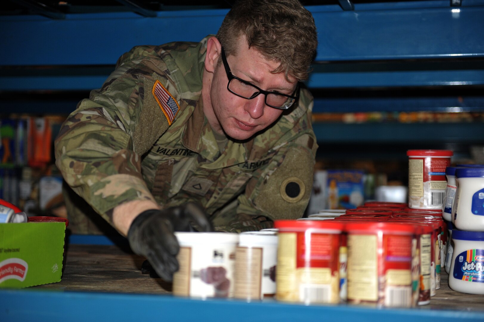 Spc. Patrick Valentine, assigned to the Ohio National Guard’s HHC 1-148th Infantry Regiment – 37th Infantry Brigade Combat Team, stocks shelves at the Toledo Northwestern Ohio Food Bank, March 25, 2020. Nearly 400 Ohio National Guard members were activated to provide humanitarian missions in support of COVID-19 relief efforts.