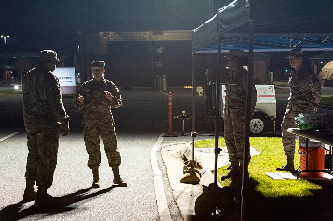 Photo of Airmen preparing for health screening operations.