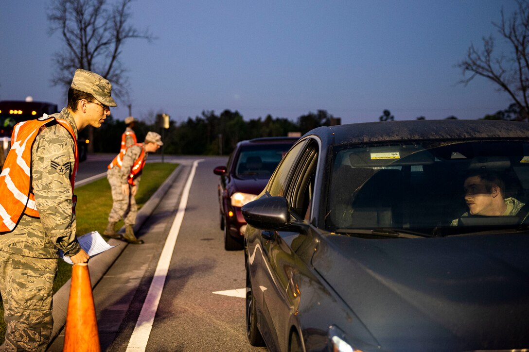 Photo of Airmen screening personnel.