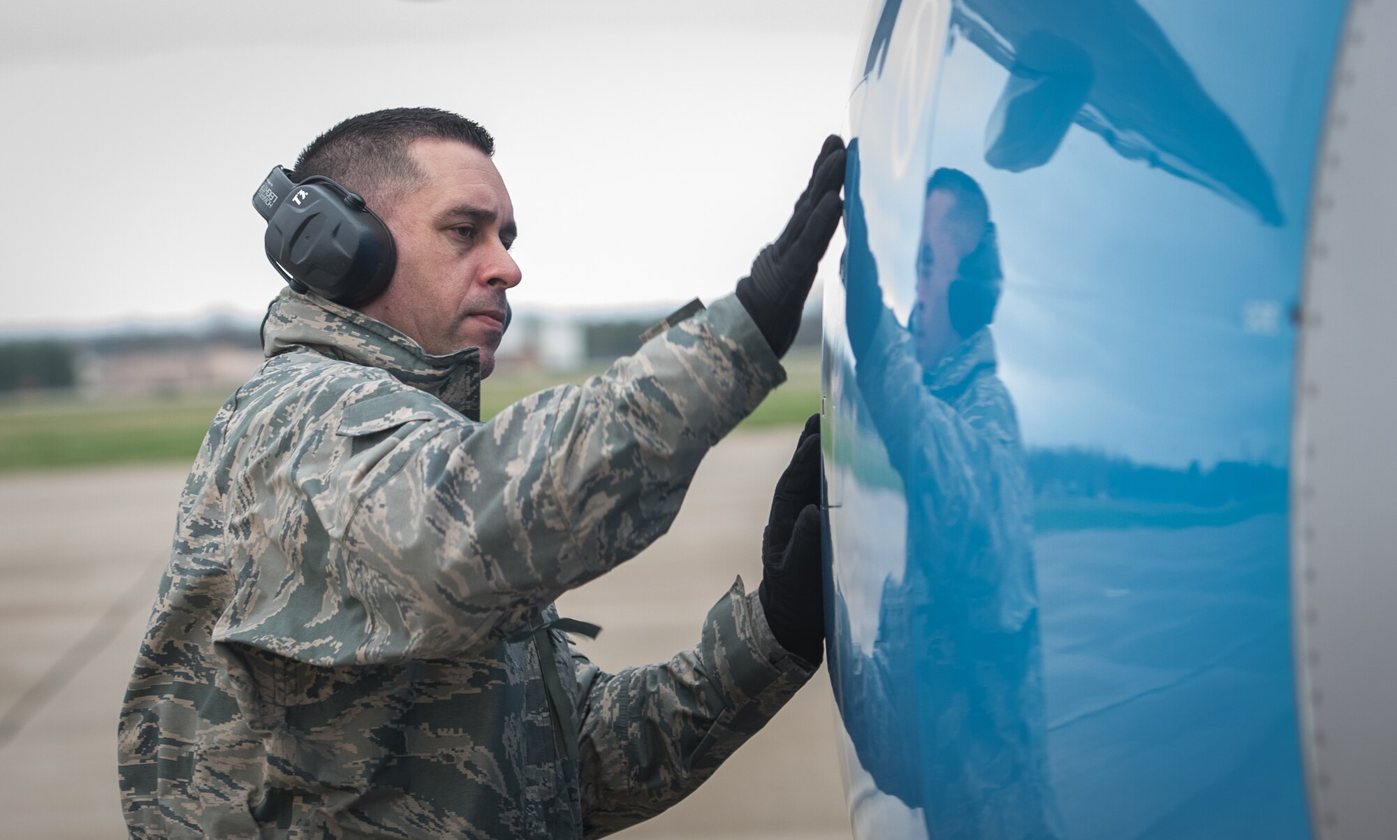 Tech. Sgt. Brandon Zangeneh, crew chief, 932nd Maintenance Squadron, performs a physical preflight inspection March, 20, 2020 Scott Air Force Base Illinois as the 932nd Airlift Wing and 73rd Airlift Squadron continue training operations during COVID-19.  Pilots are required to maintain readiness and the 932nd MXS is working hard with reduced manning in support of continued missions. The 932nd Airlift Wing is the only Air Force Reserve Command unit that flies the C-40C, which is used to provide world-class airlift for U.S. national and military leaders.(U.S. Air Force photo by Christopher Parr)