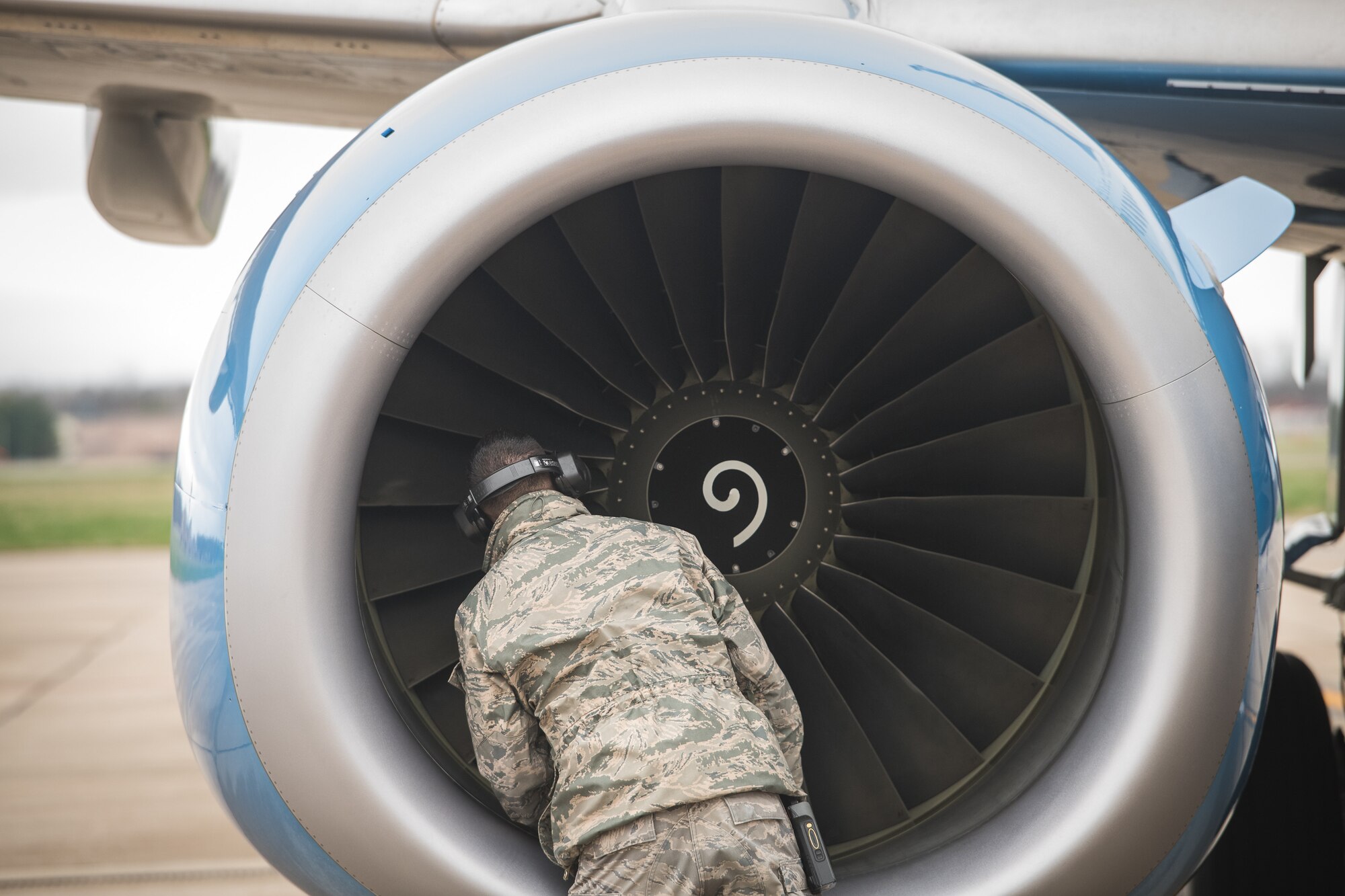 Tech. Sgt. Brandon Zangeneh, crew chief, 932nd Maintenance Squadron, performs a physical preflight inspection March, 20, 2020 Scott Air Force Base Illinois as the 932nd Airlift Wing and 73rd Airlift Squadron continue training operations during COVID-19.  Pilots are required to maintain readiness and the 932nd MXS is working hard with reduced manning in support of continued missions. The 932nd Airlift Wing is the only Air Force Reserve Command unit that flies the C-40C, which is used to provide world-class airlift for U.S. national and military leaders.(U.S. Air Force photo by Christopher Parr)