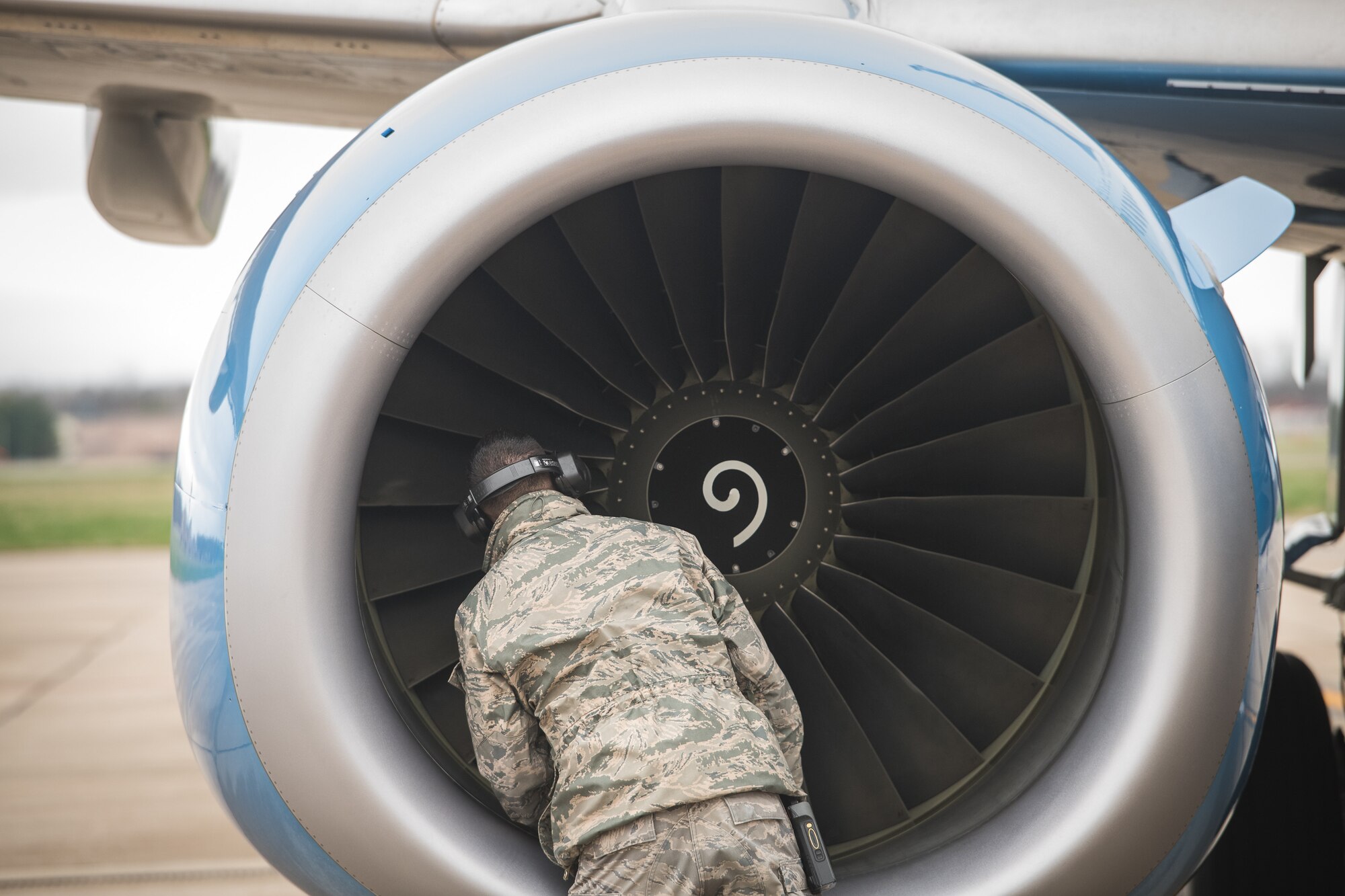 Tech. Sgt. Brandon Zangeneh, crew chief, 932nd Maintenance Squadron, performs a physical preflight inspection March, 20, 2020 Scott Air Force Base Illinois as the 932nd Airlift Wing and 73rd Airlift Squadron continue training operations during COVID-19.  Pilots are required to maintain readiness and the 932nd MXS is working hard with reduced manning in support of continued missions. The 932nd Airlift Wing is the only Air Force Reserve Command unit that flies the C-40C, which is used to provide world-class airlift for U.S. national and military leaders.(U.S. Air Force photo by Christopher Parr)