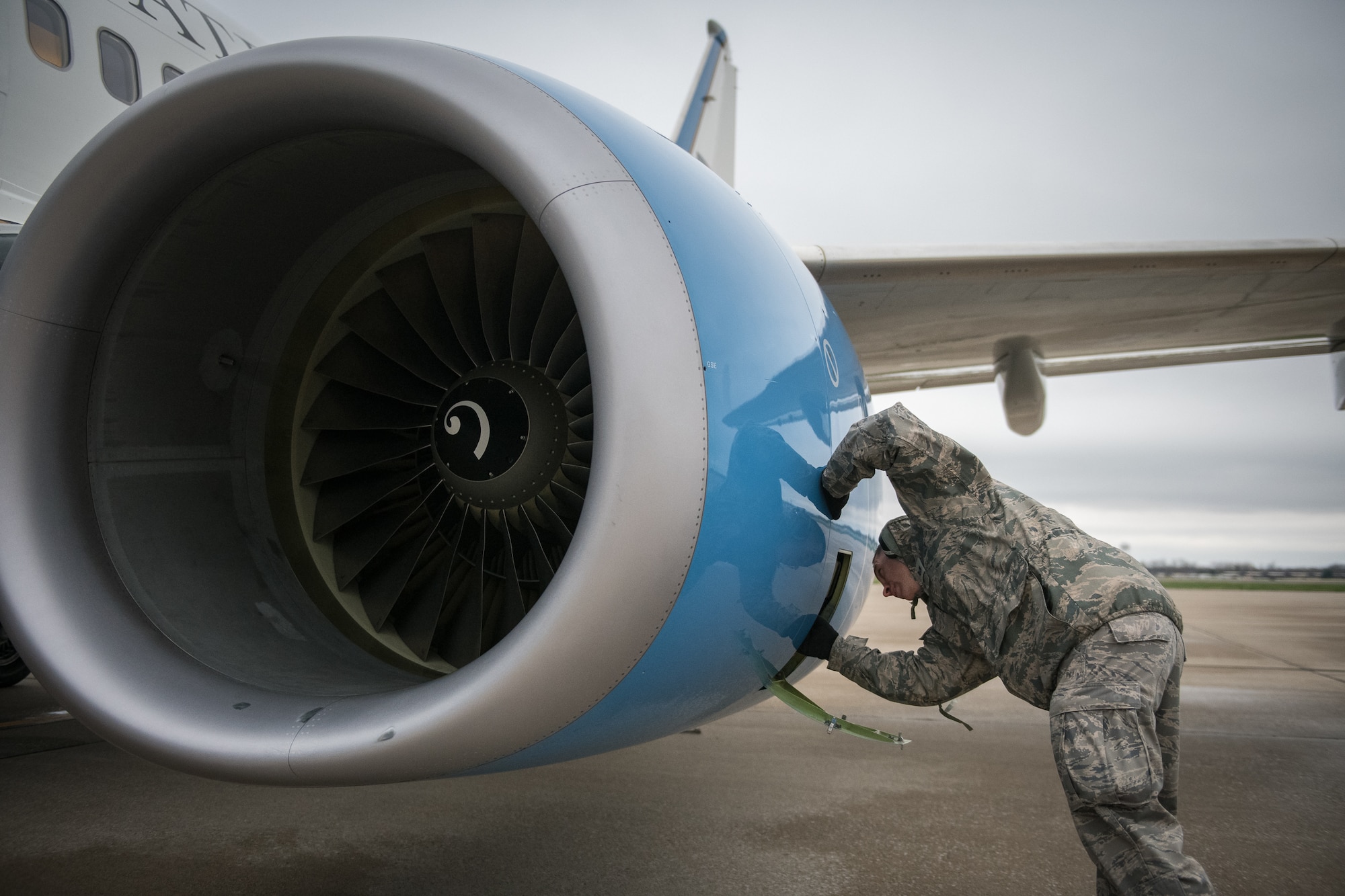 Tech. Sgt. Brandon Zangeneh, crew chief, 932nd Maintenance Squadron, performs a physical preflight inspection March, 20, 2020 Scott Air Force Base Illinois as the 932nd Airlift Wing and 73rd Airlift Squadron continue training operations during COVID-19.  Pilots are required to maintain readiness and the 932nd MXS is working hard with reduced manning in support of continued missions. The 932nd Airlift Wing is the only Air Force Reserve Command unit that flies the C-40C, which is used to provide world-class airlift for U.S. national and military leaders.(U.S. Air Force photo by Christopher Parr)