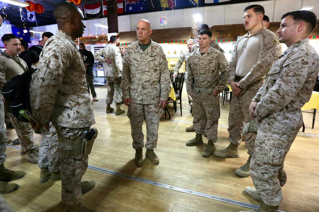 Commandant of the Marine Corps Gen. David H. Berger speaks with Marines after a town hall while visiting Al Taqaddum, Iraq, Dec. 11, 2019. Gen. Berger spoke about his expectations for the force and thanked Marines for their continued success. He also met with Marine Corps leaders to discuss current and future partnerships across the region. This is Gen. Berger’s first visit to the CENTCOM area of operation as Commandant.