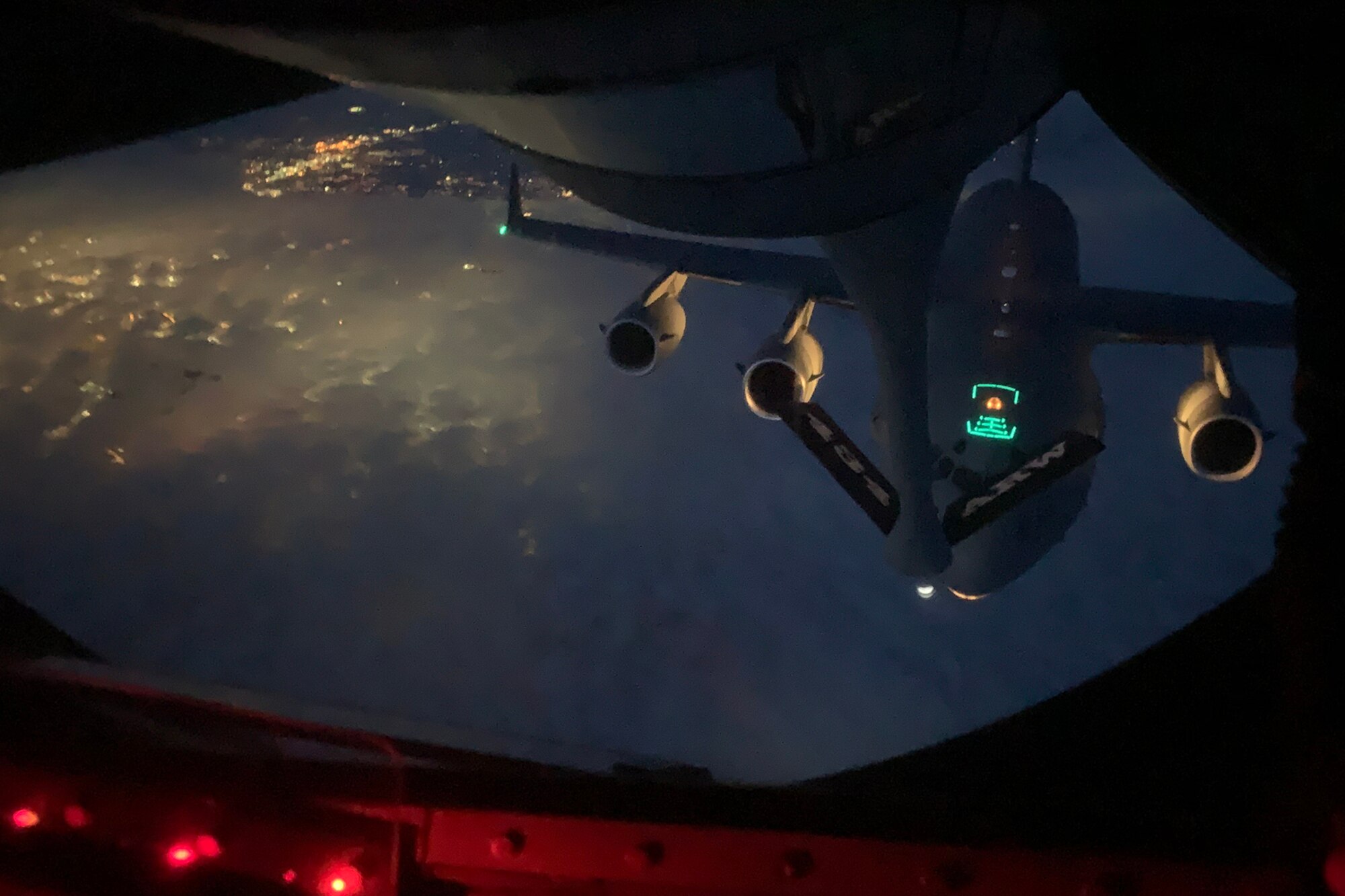 A C-17 Globemaster from the 445th Airlift Wing, Wright-Patterson AFB, Ohio lines up to receive fuel from a KC-135R Stratotanker from Grissom ARB, Indiana, March 24, 2020. Reserve Citizen Airmen continue to maintain readiness and perform missions during the Novel Coronavirus-19 outbreak. (U.S. Air Force photo/Staff Sgt. Brian Wright)