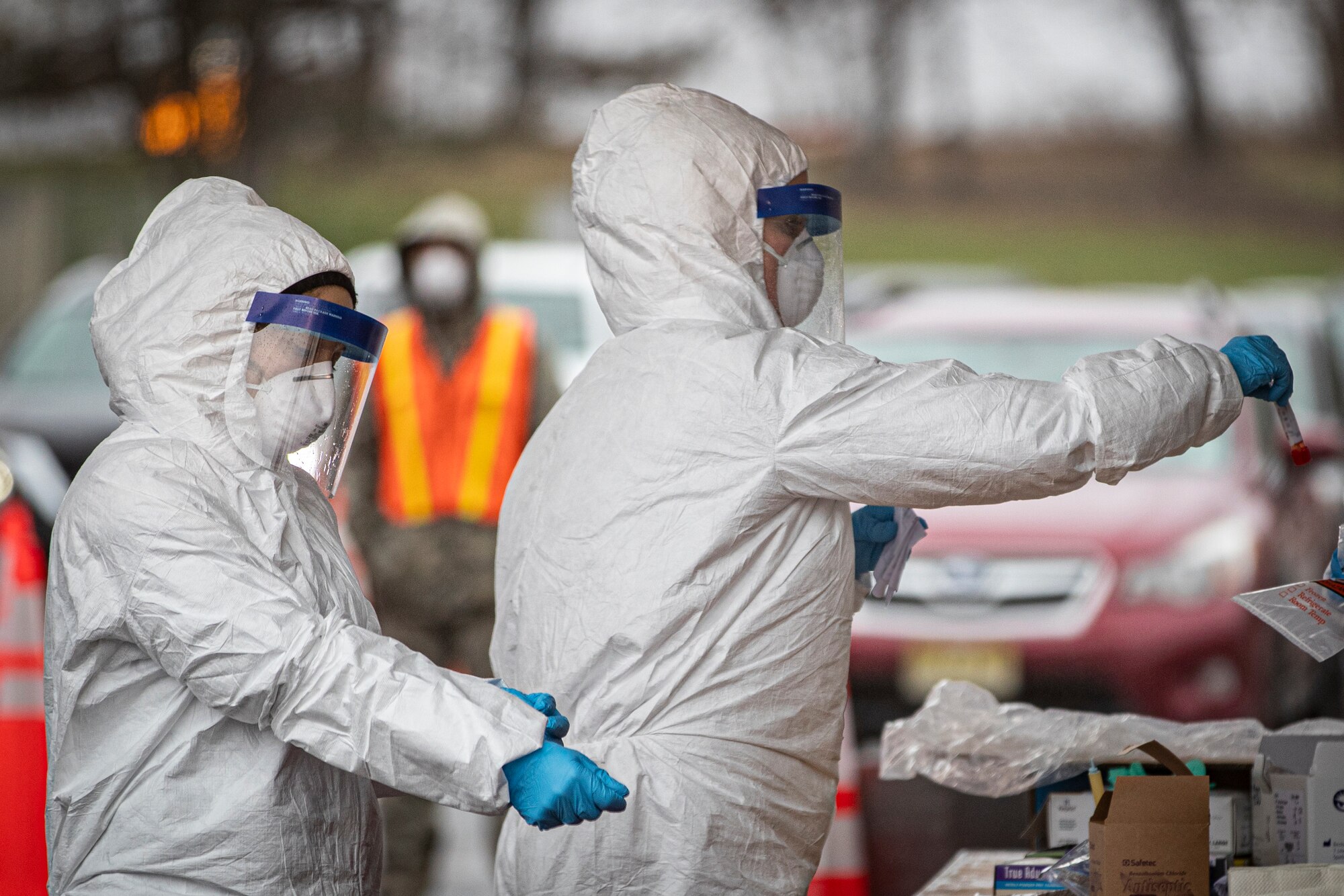 New Jersey Air National Guard medics with the 108th Wing process specimens at a COVID-19 Community-Based Testing Site at the PNC Bank Arts Center in Holmdel, New Jersey, March 23, 2020. The testing site, established in partnership with the Federal Emergency Management Agency, is staffed by the New Jersey Department of Health, the New Jersey State Police, and the New Jersey National Guard. (U.S. Air National Guard photo by Master Sgt. Matt Hecht)