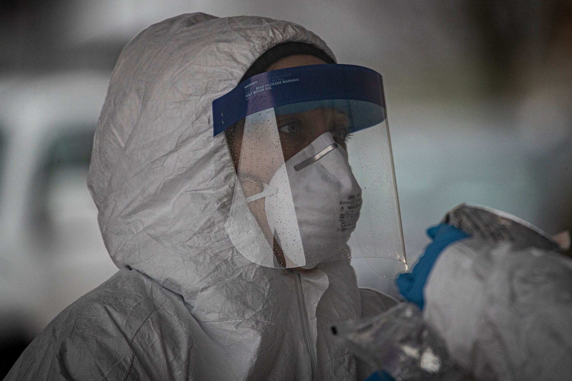New Jersey Air National Guard medics with the 108th Wing process specimens at a COVID-19 Community-Based Testing Site at the PNC Bank Arts Center in Holmdel, N.J., March 23, 2020.  The testing site, established in partnership with the Federal Emergency Management Agency, is staffed by the New Jersey Department of Health, the New Jersey State Police, and the New Jersey National Guard.
