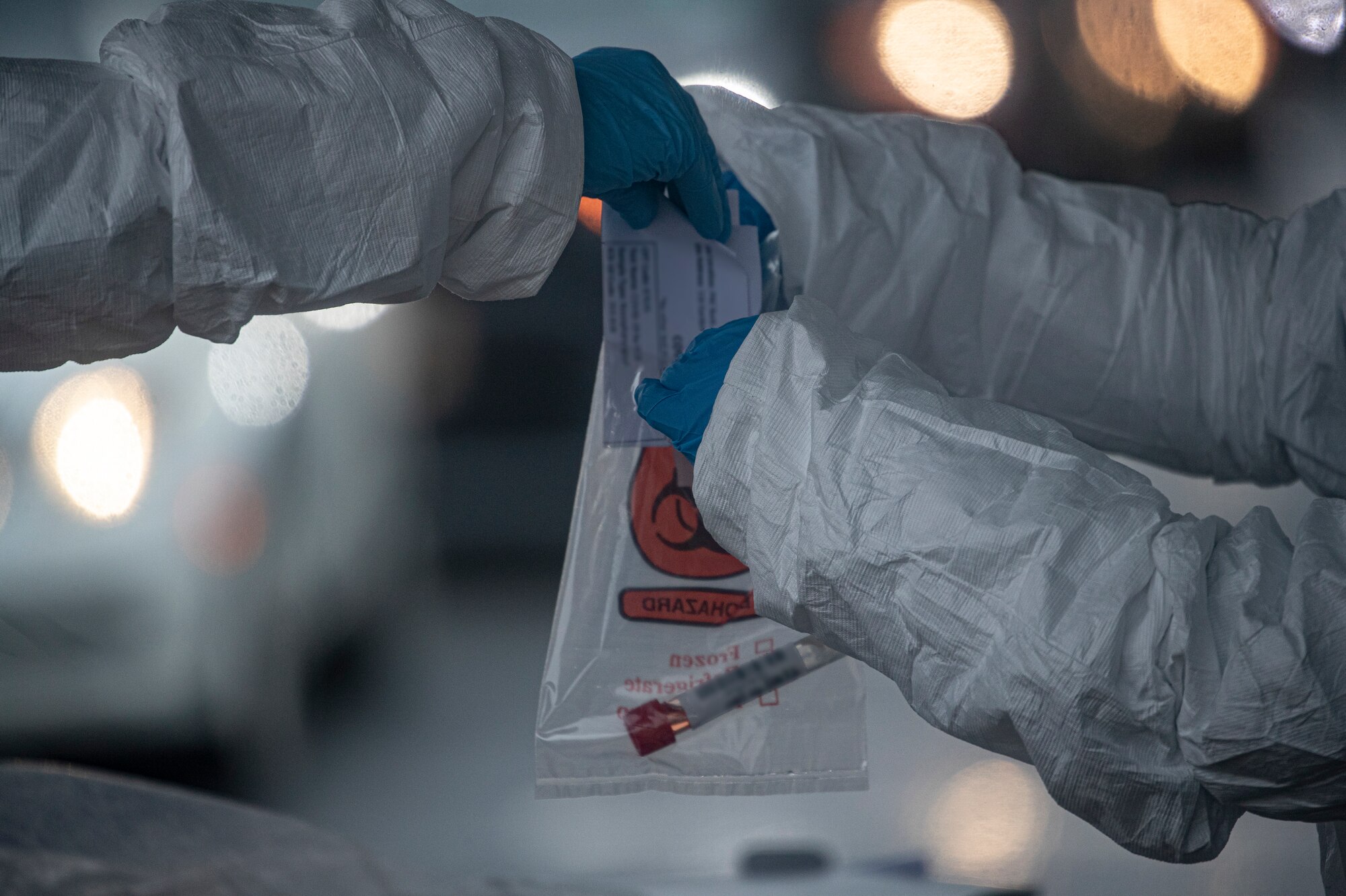 New Jersey Air National Guard medics with the 108th Wing process specimens at a COVID-19 Community-Based Testing Site at the PNC Bank Arts Center in Holmdel, N.J., March 23, 2020.  The testing site, established in partnership with the Federal Emergency Management Agency, is staffed by the New Jersey Department of Health, the New Jersey State Police, and the New Jersey National Guard.