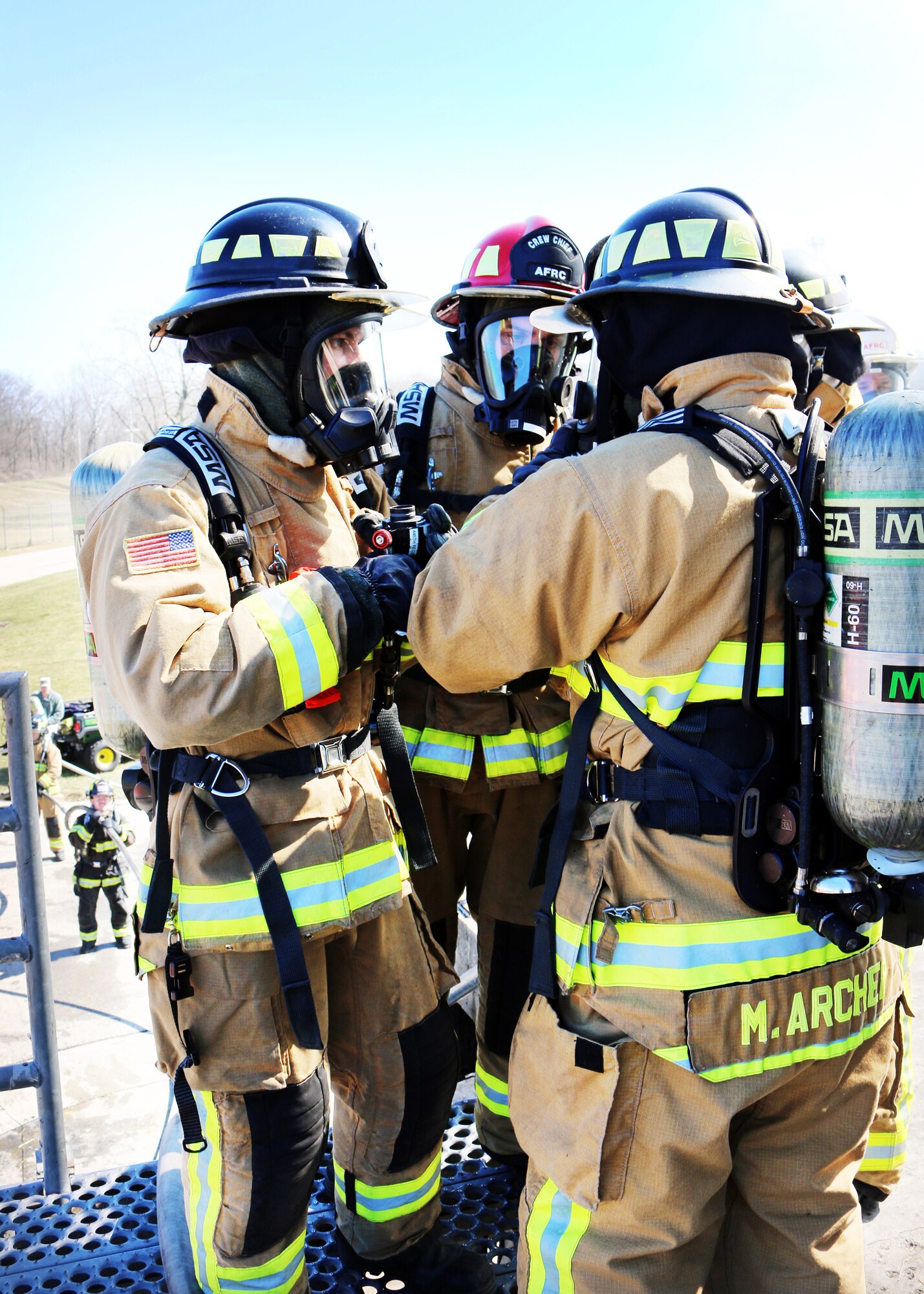 Reserve Citizen Airmen from the 445th Civil Engineer Squadron, Fire and Emergency Services Flight, partnered with the community fire department at the Dayton Fire Department training facilities in Ohio on March 7, 2020 to meet an annual training requirement for a structure fire. Teams worked in groups of five to maneuver a hose through the building and into the basement where the fire was extinguished.