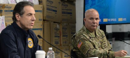 New York Army National Guard Maj. Gen. Raymond Shields, the New York adjutant general, listens to Gov. Andrew M. Cuomo at a press conference at the Jacob K. Javits Convention Center in New York, N.Y., March 24, 2020. The center will be an alternate care site as part of New York’s multi-agency response to COVID-19.