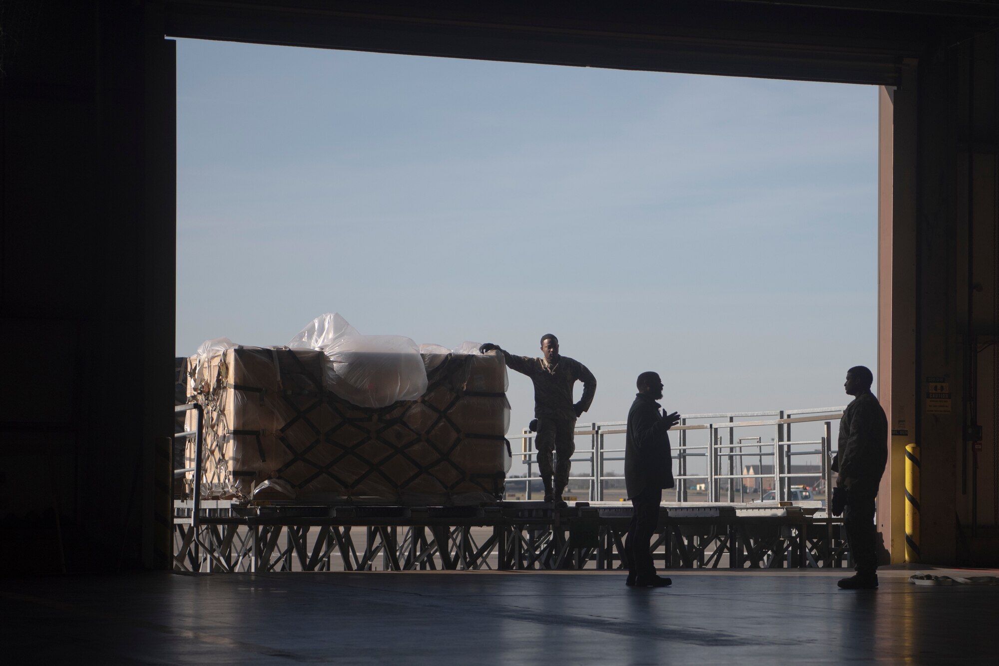 Airmen of the 727th Air Mobility Squadron take a break after transferring cargo from the flight line to their warehouse March 24, 2020, at RAF Mildenhall, England. Their schedule is influenced by how many aircraft arrive and the amount of cargo that needs to be unloaded . (U.S. Air Force photo by Airman 1st Class Joseph Barron)