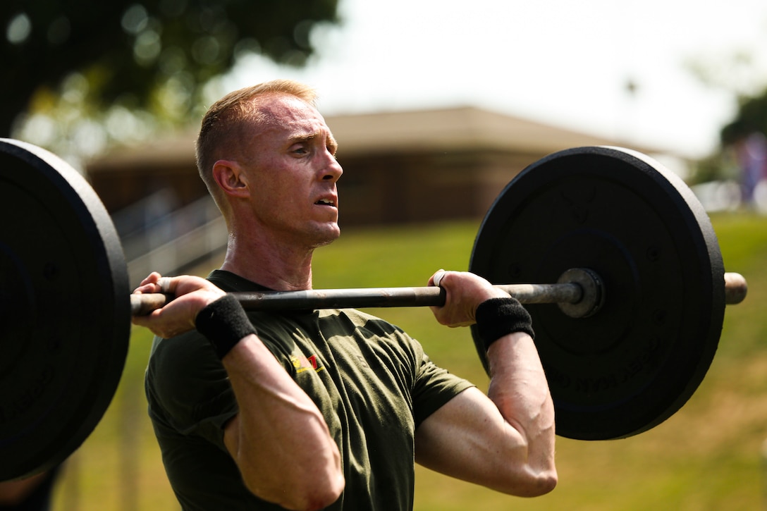 Gunnery Sgt. Justin Gates performs a power clean during the fourth event of the 2019 HITT Championship at Butler Stadium aboard Marine Corps Base Quantico, Va., Sep. 10.