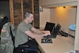 A makeshift office in his basement allows Staff Sgt. Andrew Menard, to continue recruiting for the force.