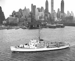 USCGC Westwind escorting a vessel through the ice- no date.