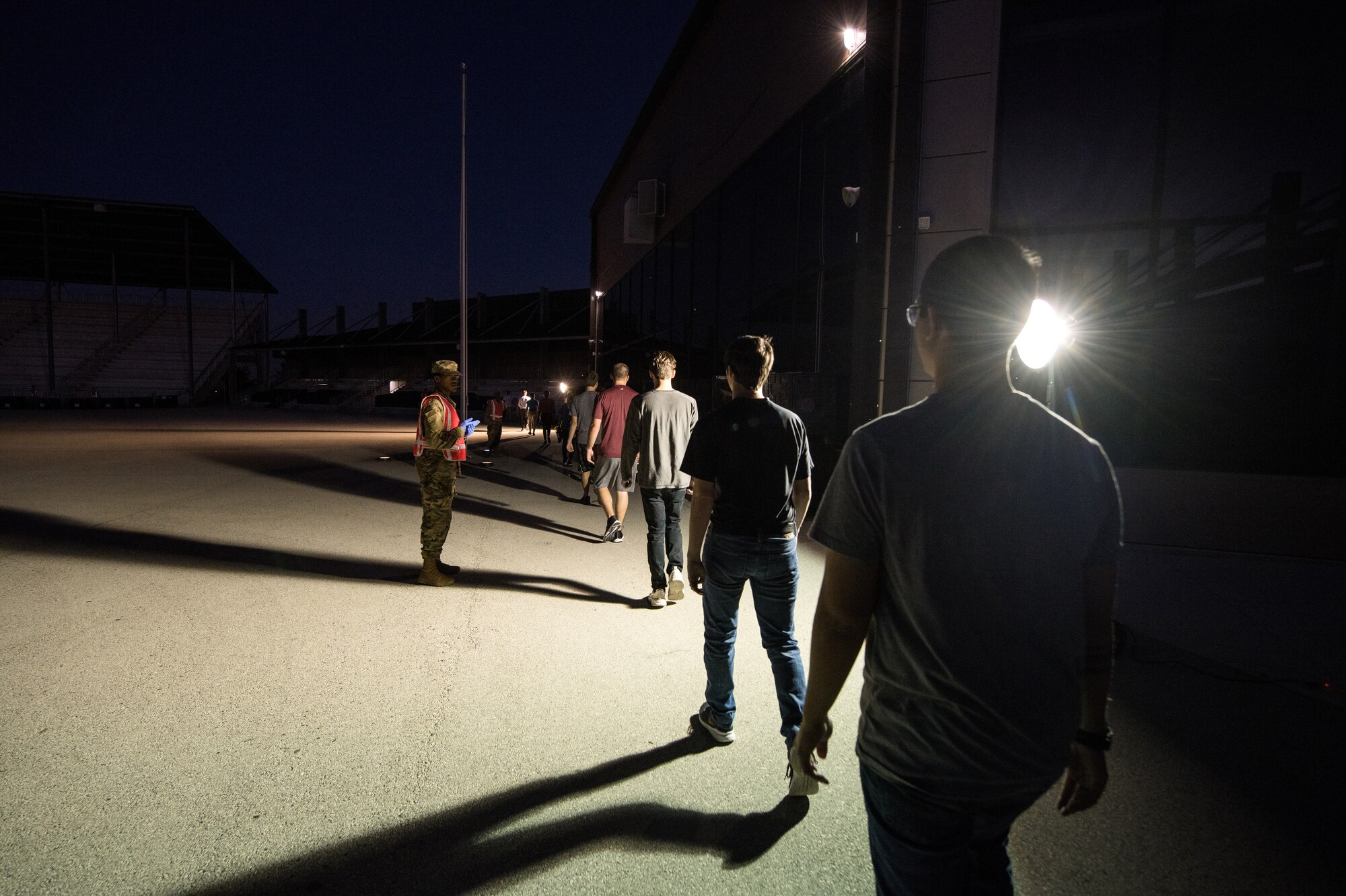 U.S. Air Force basic training trainees that will be placed in a 14-day restriction of movement period arrive at the 737th Training Support Squadron March 24, 2020, at Joint Base San Antonio-Lackland, Texas.