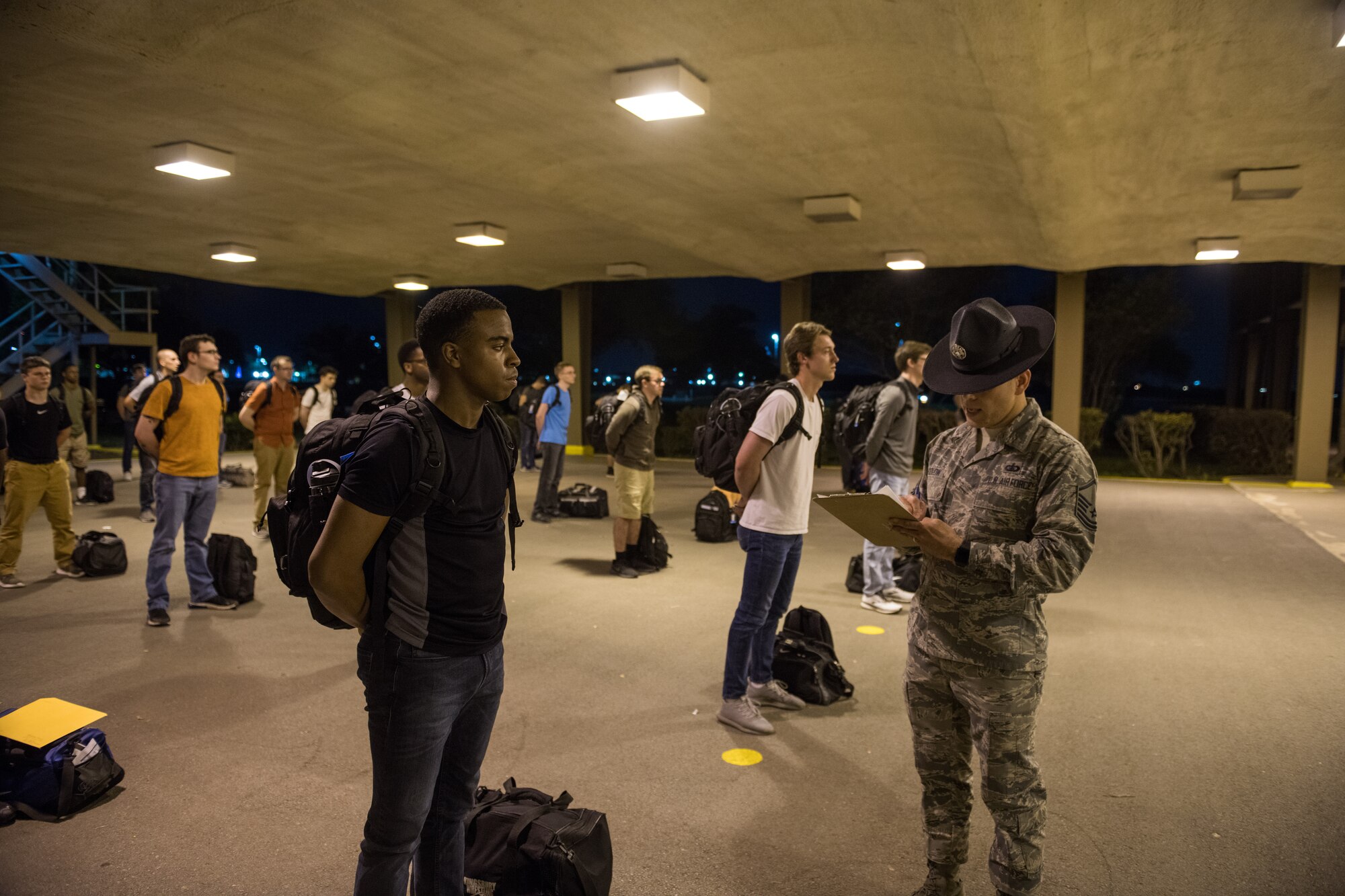 U.S. Air Force basic training trainees that will be placed in a 14-day restriction of movement period arrive at the 737th Training Support Squadron March 24, 2020, at Joint Base San Antonio-Lackland, Texas.