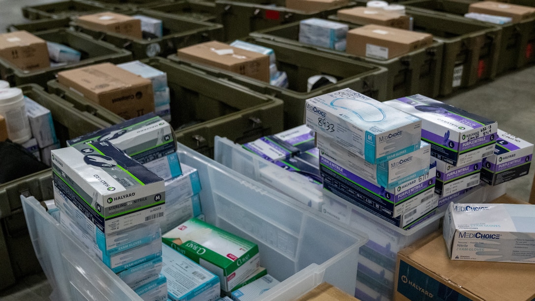 Medical kids are packed by Sailors with 2nd Medical Logistics Company, 2nd Supply Battalion, 2nd Marine Logistics Group, on Camp Lejeune, North Carolina, March 18, 2020. The Sailors are preparing kits to provide for national coronavirus aid alongside II Marine Expeditionary Force and will include hand sanitizer gel, surgical masks, disinfectant wipes, latex gloves, sphygmomanometers, stethoscopes, thermometers, and isolation gowns. (U.S. Marine Corps photo by Cpl. Rachel K. Young-Porter)