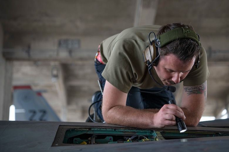 U.S. Air Force Staff Sgt. Zacharias Clemmons, 18th Aircraft Maintenance Squadron crew chief, performs a hydraulics operations check on an F-15C Eagle March 27, 2020, at Kadena Air Base, Japan. The hydraulics check is performed by running a series of tests, which simulate the same conditions likely to occur in-flight.  Airmen are working around the clock ensuring aircraft are ready for flight training operations in order to promote a free and open Indo-Pacific. (U.S. Air Force photo by Senior Airman Rhett Isbell)