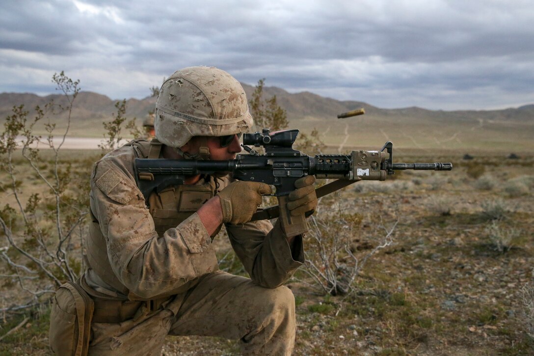 U.S. Marine Corps Lance Cpl. Samuel Argentieri, a light armored vehicle mechanic, with 2nd Light Armored Reconnaissance Battalion, 2nd Marine Division, fires his rifle at a notional enemy target during a live-fire range on the National Training Center 20-05 in Ft. Irwin, Calif., March 22, 2020. The National Training Center is a unique opportunity that allows Marines and Sailors to train with and against a peer competitor in a conventional combat operational setting. (U.S. Marine Corps photo by Cpl. Elijah J. Abernathy)