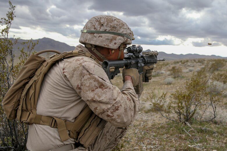 U.S. Marine Corps Pfc. Andy Solis, a rifleman with 2nd Light Armored Reconnaissance Battalion, 2nd Marine Division, fires his rifle at a notional enemy target during a live-fire range on the National Training Center 20-05 in Ft. Irwin, Calif., March 22, 2020. The National Training Center is a unique opportunity that allows Marines and Sailors to train with and against a peer competitor in a conventional combat operational setting. (U.S. Marine Corps photo by Cpl. Elijah J. Abernathy)