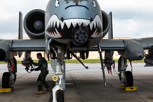 Photo of pilot performing preflight checks.