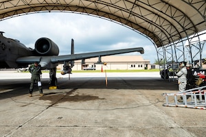 Photo of Airmen preparing for takeoff.