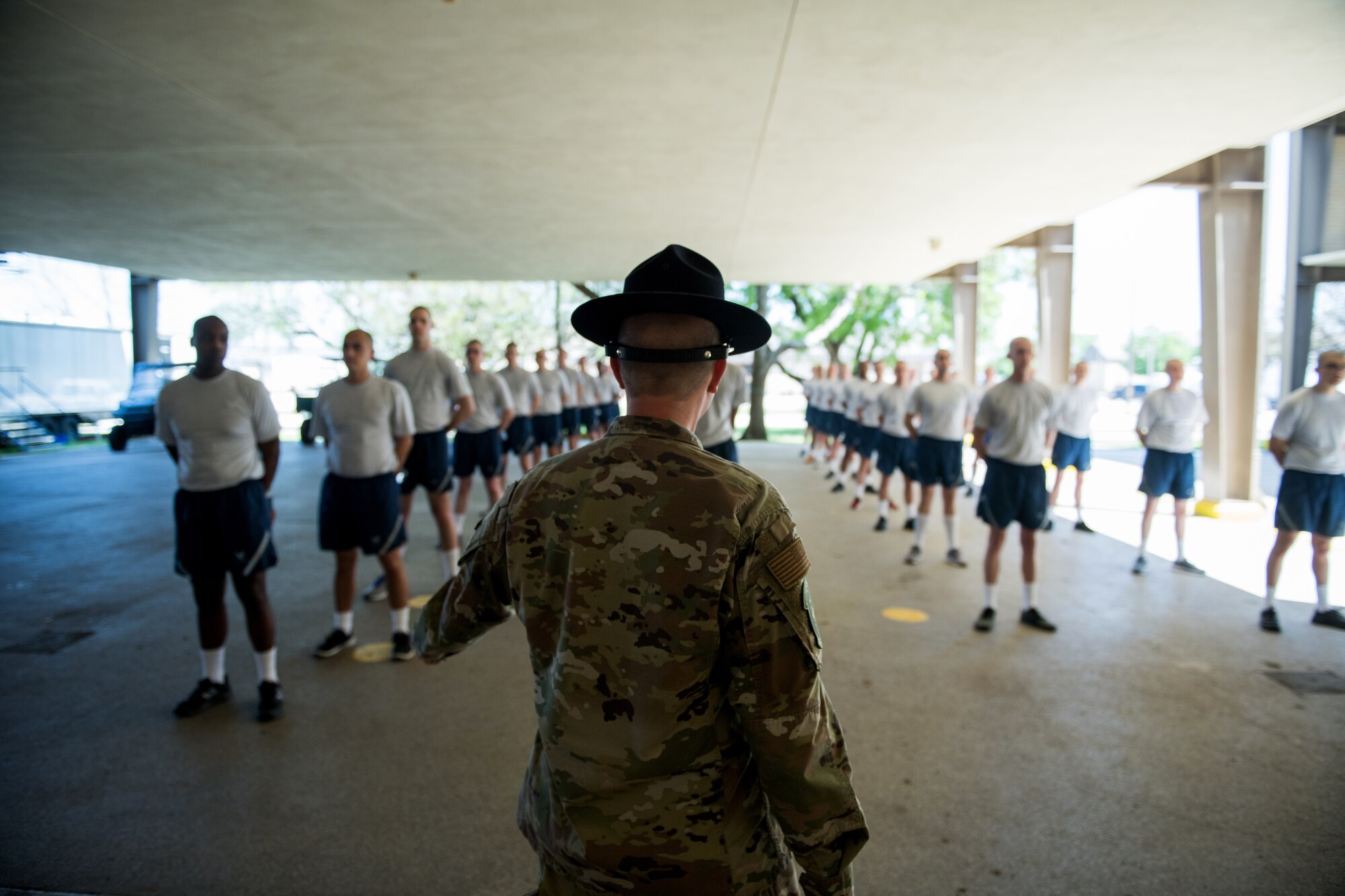 U.S. Air Force basic training trainees that will be placed in a 14-day restriction of movement period arrive at the 737th Training Support Squadron March 24, 2020, at Joint Base San Antonio-Lackland, Texas.