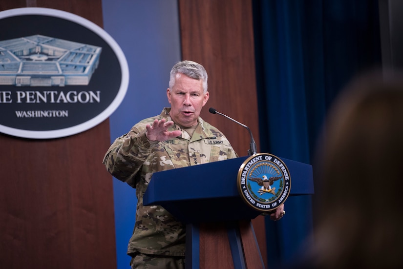 A man stands at a podium.